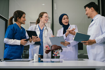 Medical, meeting and laptop for team in office in discussion, brainstorming and planning. Doctor, nurse and computer on desk, teamwork or workshop for Model Internal organ.