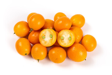 ripe cumquat or kumquat fruit with half isolated on white background