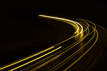 yellow car lights at night. long exposure