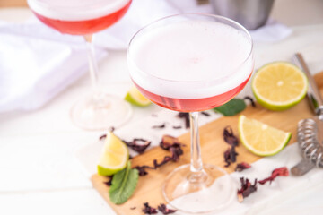 Hibiscus martini drink with ice, lime and mint