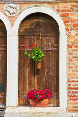 Detail of architecture and Iron Fountain in Murano, Venice, Veneto, Italy.