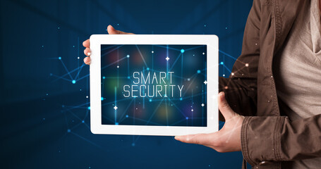 Person holding tablet, security concept