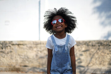 Portrait happy african american cute girl smiling face looking at camera at home, kid, child, young adorable, student, elementary school and education concept