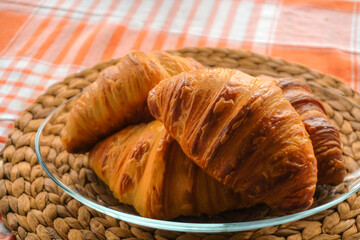 Croissant and coffee breakfast appetizers close up view