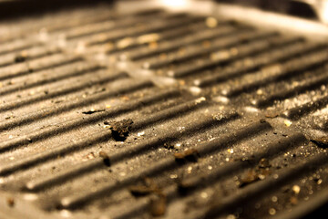 Bread crumbed dirty pan close up view