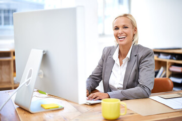 Lawyer, woman and portrait by computer with smile for legal services with pride, knowledge and...
