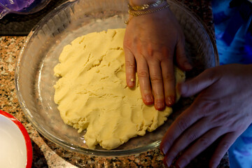 Sweet dough apple pie preparation in the kitchen close up view