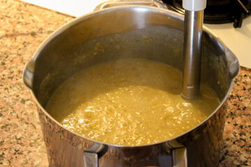 Lentil soup preparation in the kitchen close up view