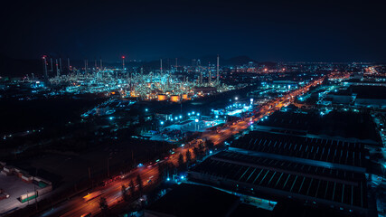 Aerial view night scene, traffic light, city and industrial plant, oil refinery, blue tone, - obrazy, fototapety, plakaty