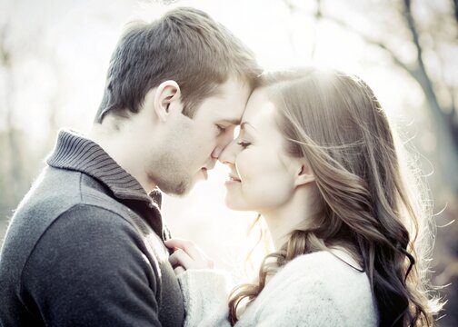 Portrait of a beautiful young couple in love. Outdoor shot.