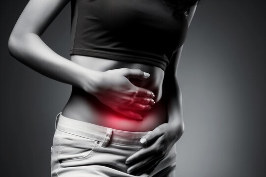 Girl holding her stomach in pain, suffering from stomach pain