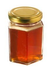 Glass bottle of fine honey with golden lid on white background. Agriculture organic product famous for its sweet taste and health benefits and value.