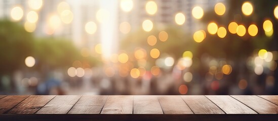 A wooden table surrounded by a blurry background of twinkling Christmas lights, creating a warm and festive atmosphere