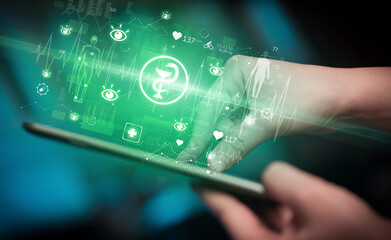Close-up of a touchscreen with healthcare icons