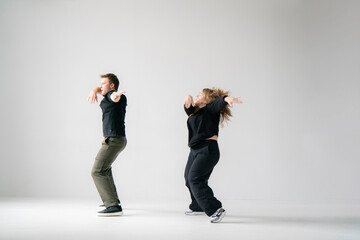 modern moves of routine in dance clip performing by young man and woman - 762187235