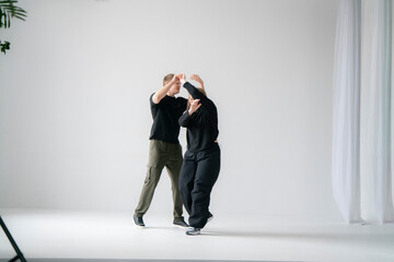 young male and female pair Practicing a Dynamic Routine, doing modern dance choreography - 762187255