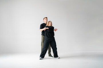 modern moves of routine in dance clip performing by young man and woman - 762187267