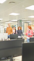 an office colleagues entering the office as a group to start the work day