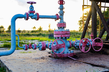 Oil pipeline and pumping unit, closeup of photo