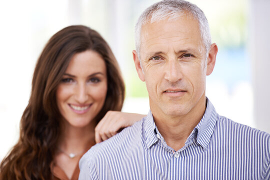 Portrait, happy and senior man with woman for love, commitment and support with trust for relationship. Couple, age difference and together with pride for connection, bonding and respect with loyalty