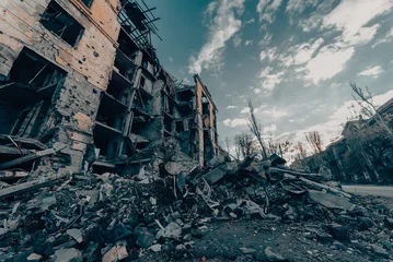 Fototapeten destroyed and burned houses in the city during the war in Ukraine © Sofiia