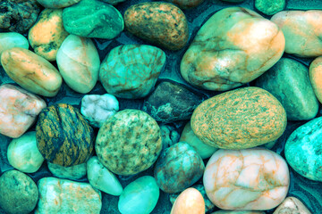 Colorful wet pebbles. Abstract nature pebbles background - 762204219