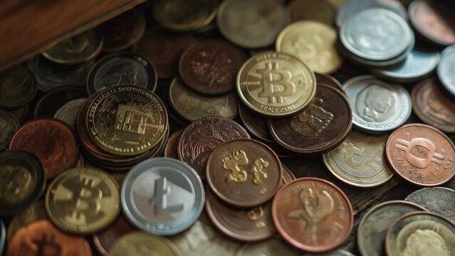 Variety Of Cryptocurrency Coins In A Wooden Drawer