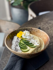 Smoothie bowl with yoghurt,  coconut flakes and chia, beautifully decorated. 