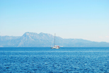 Yacht on the Adriatic sea on the mountains background. Sailing ship on the Croatia landscape. Sea...