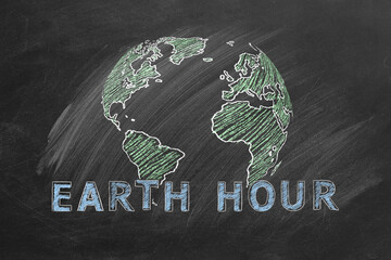 Globe with lettering EARTH HOUR hand drawn in chalk on a school blackboard. Save the World. Save our planet. - obrazy, fototapety, plakaty