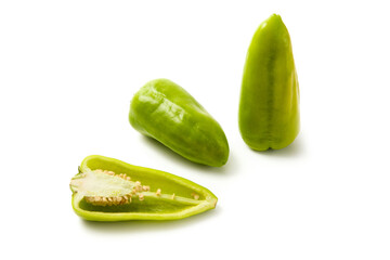 Two whole and half of green bell pepper with soft shadow isolated on white background. .