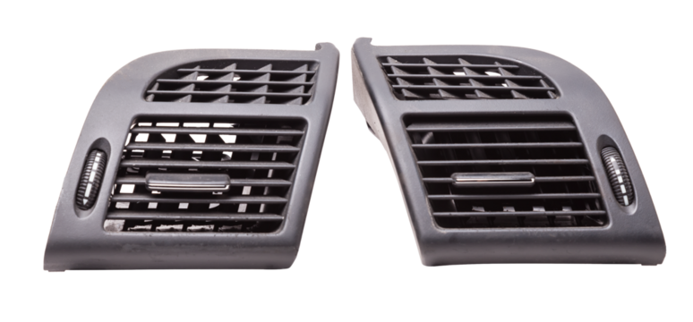 A close-up view of a part of the interior of a modern car with a view of the ventilation deflector of the heater for heating and cooling the passenger compartment. Used auto part catalog from junkyard