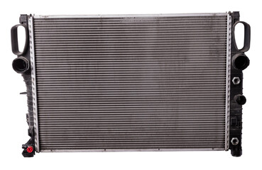 Fototapeta premium The cooling radiator is a metal heat exchanger inside filled with antifreeze. Rubber pipes are connected to it, which are mounted on the corresponding neck of the motor. Repair in the workshop.