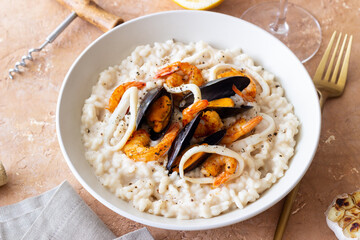 Risotto with mussels, shrimps and squid. Italian cuisine. Seafood.