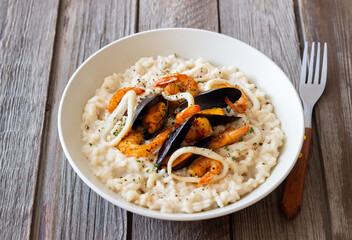 Risotto with mussels, shrimps and squid. Italian cuisine. Seafood.