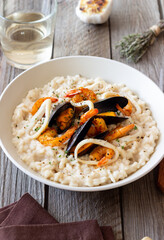 Risotto with mussels, shrimps and squid. Italian cuisine. Seafood.