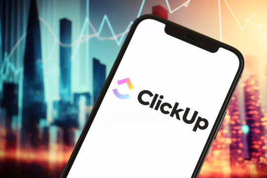 KYIV, UKRAINE - MARCH 17, 2024 ClickUp logo on iPhone display screen with background of artificial intelligence futuristic ai generated image close up