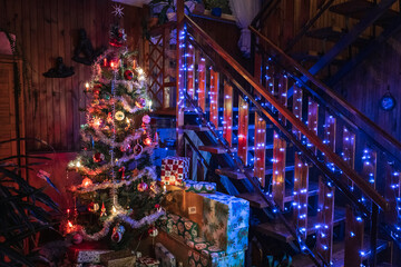 Obraz premium Christmas tree with gifts in a living room