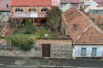 Top view of old houses with tiled roofs. House territory near old houses. The old district in the city of Vladikavkaz.