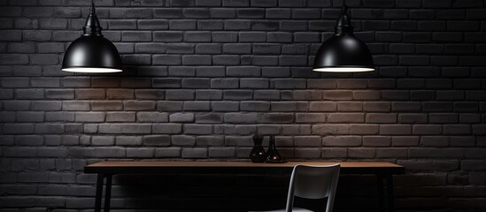 A dimly lit room with a wooden table and chairs set against a black brick wall. The hardwood...