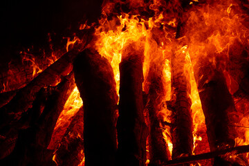 A close-up of flames consuming a wood log