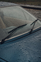 Raindrops on a car on a rainy autumn day.