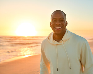 Portrait Of Casually Dressed Young Man Watching Sunrise Morning Over Beach And Sea In South Africa