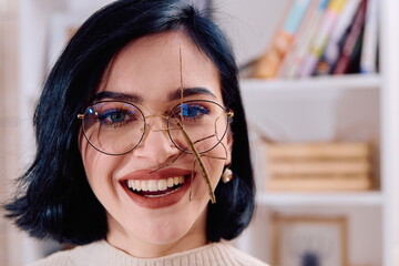 Young Woman Captured in a Beautiful Moment with Her Stick Insect (Medauroidea Extradentata)