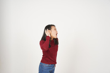 Young Asian woman in Red t-shirt hand on ear, cant hear you concept isolated on white background