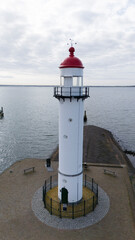 High sea water level at the lighthouse from hellevoetlsuis drone photo - 762247248