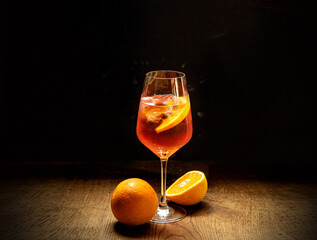 Italian summer drink with orange slice and ice