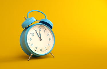 Blue metal vintage alarm clock on yellow background. Analogue alarm clock five to twelve copy space...