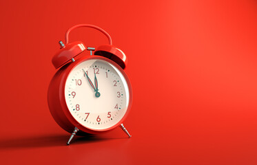 Red metallic vintage alarm clock on red background. Analogue alarm clock five to twelve all in red...