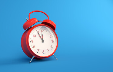 Red metallic vintage alarm clock on blue background. Analogue alarm clock five to twelve copy space illustration.